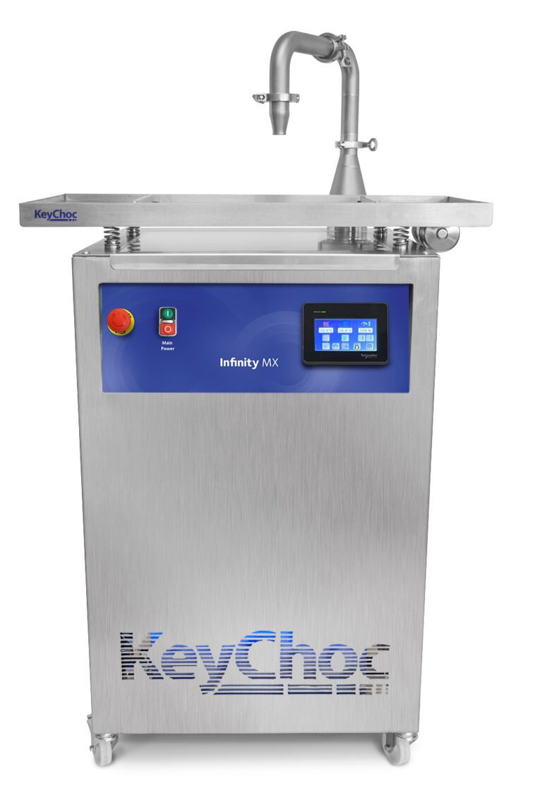 KeyChoc Infinity MX chocolate tempering machine, front view, with touchscreen control panel, power buttons, vibrating tray, overhead dispensing spout and castor wheels